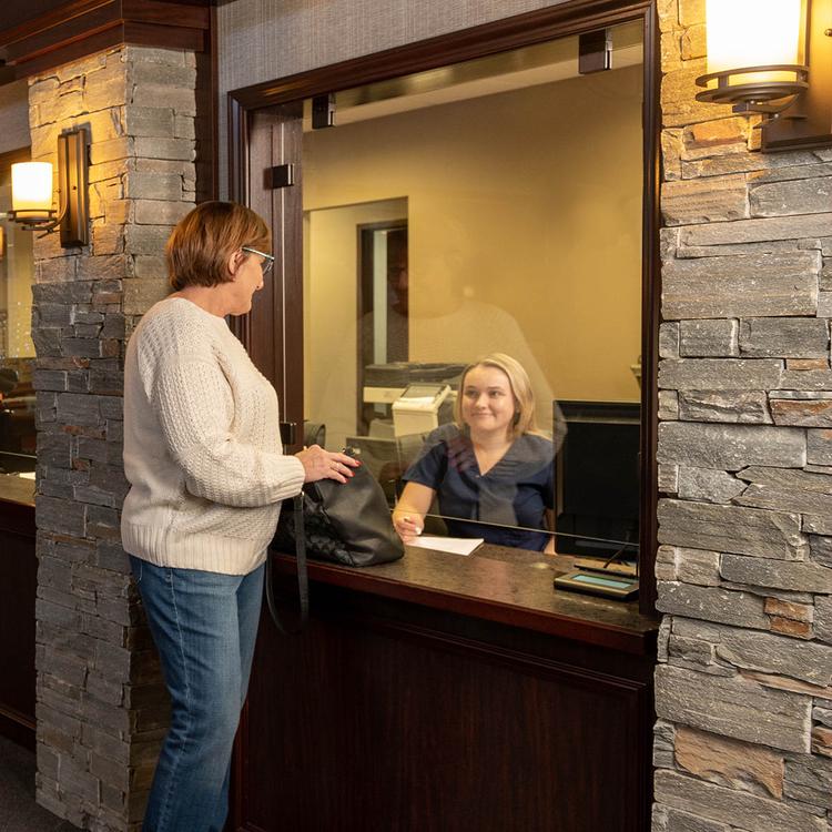 woman waiting as reception desk