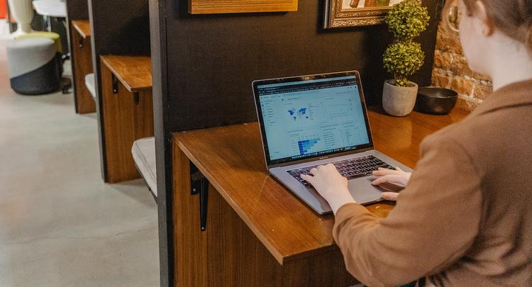 small business owner working on google analytics on laptop