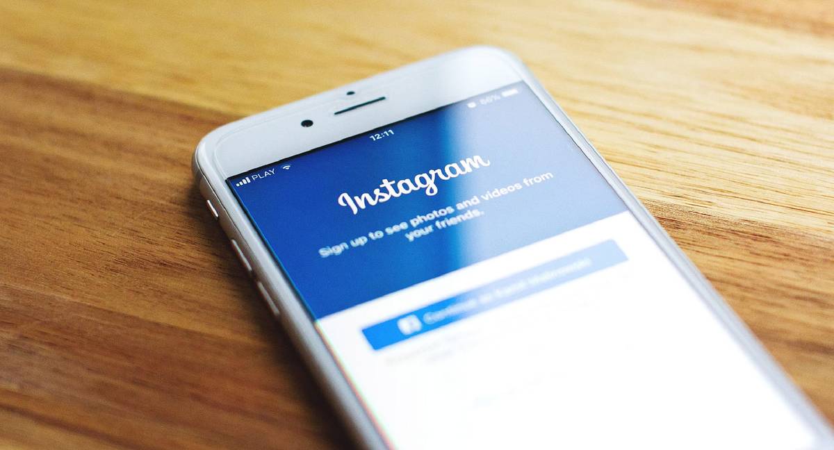 Smart phone on table with Instagram on screen