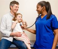 photo of nurse with man and daughter