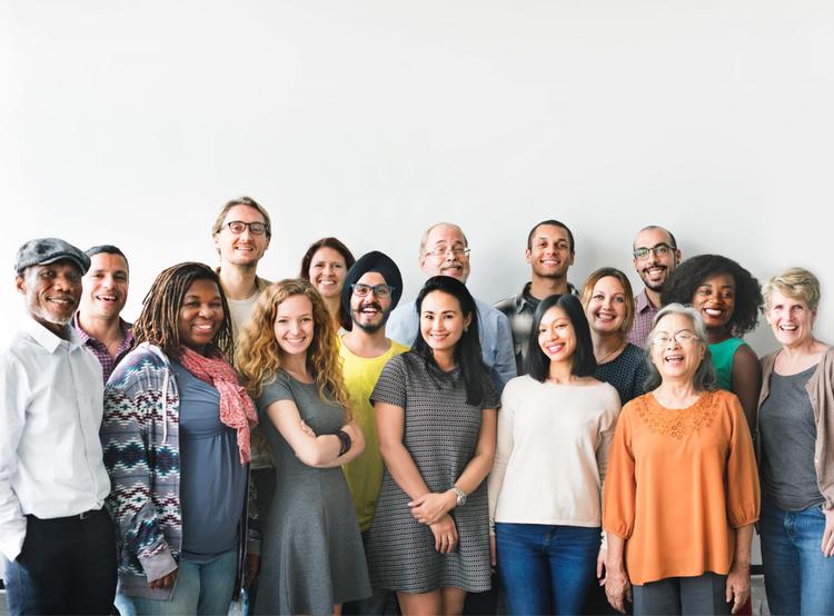 group of people in front of white wall
